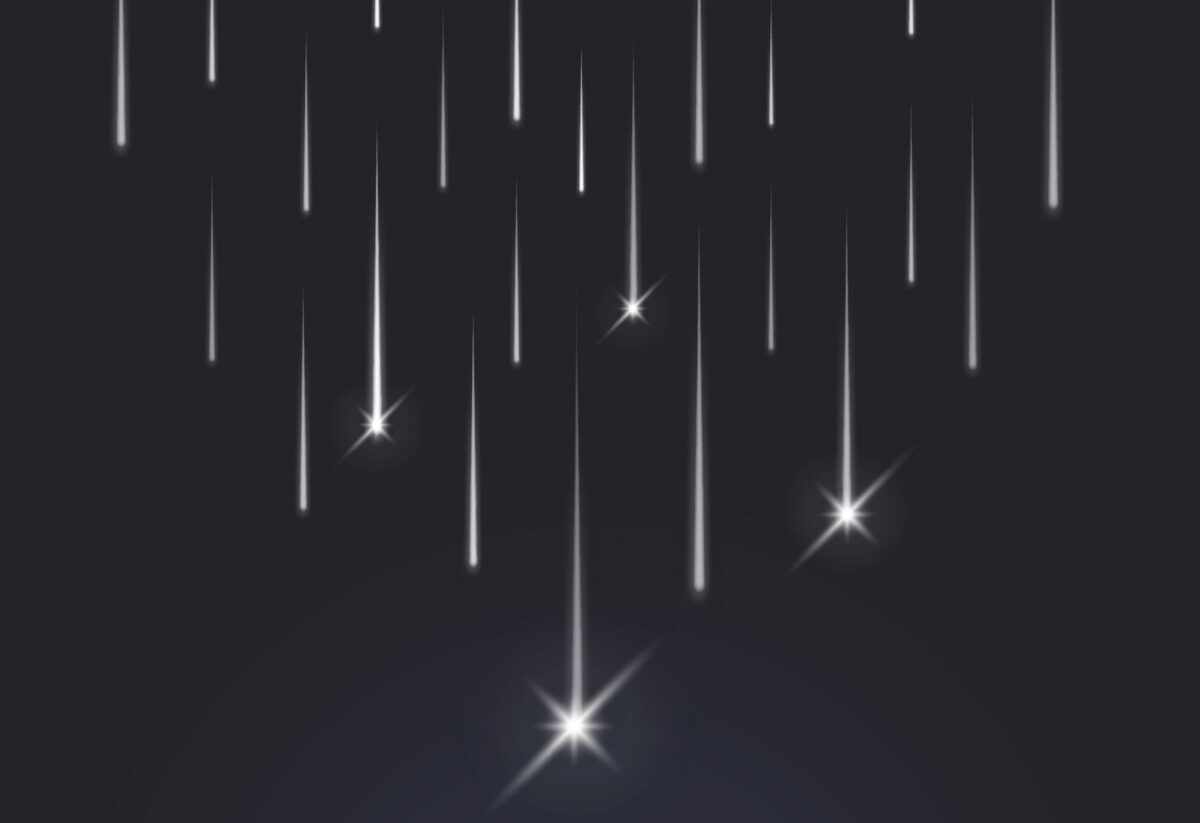 image of a dark, starry night sky with streaking meteors