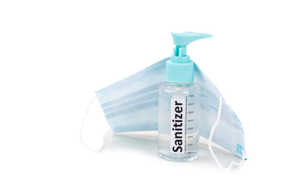Image of sanitizer and a mask