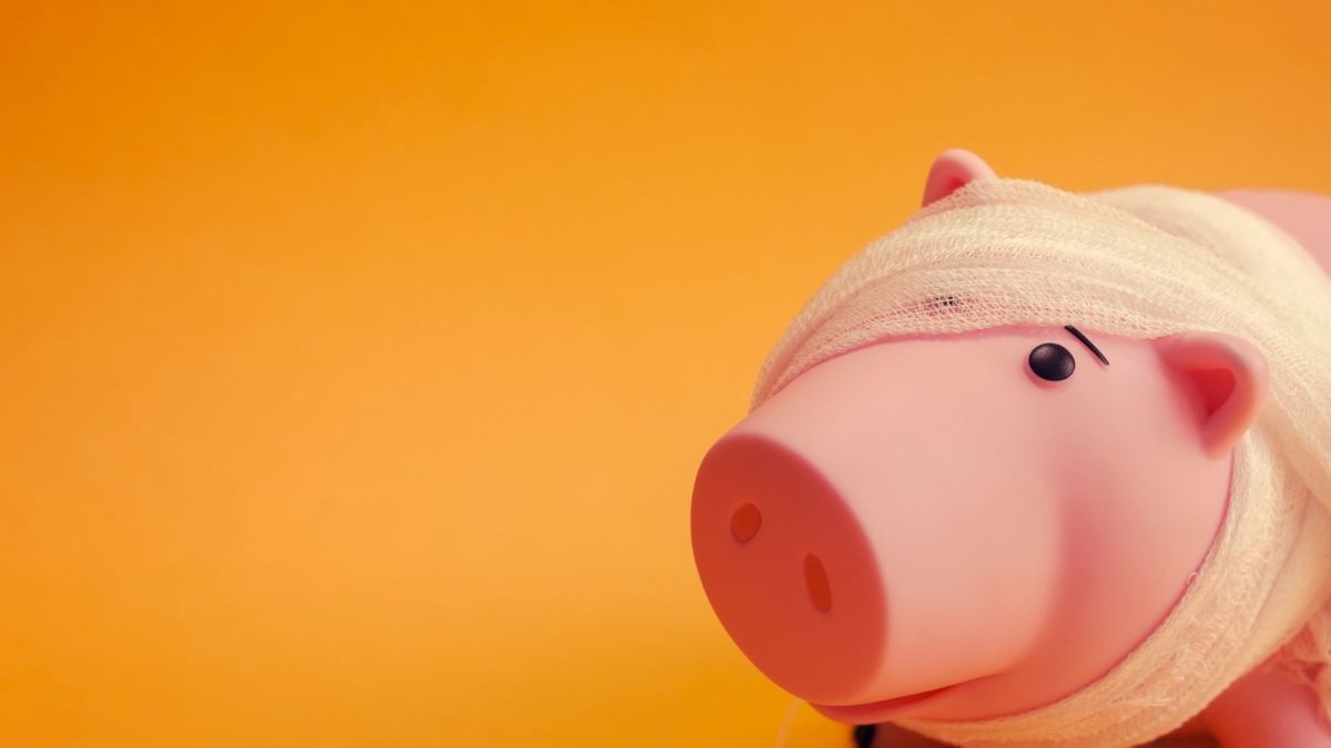 A Bandaged Piggy Bank: Symbolising Financial Mistakes